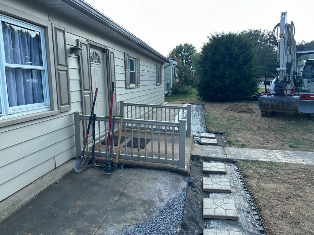 River rock was placed near the home and over the drain to create an appealing look.