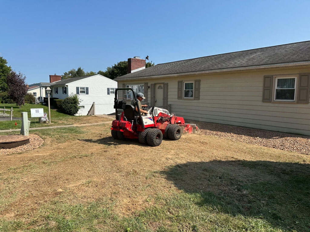 The lawn area was power-raked to a smooth finish.